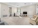 Bonus room with plush carpet, neutral walls, a television, a comfortable recliner and gaming-themed decor at 4418 Lions Gate Ave, Clermont, FL 34711