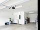 Spacious two-car garage with ample storage space and an automatic door opener for convenience at 4418 Lions Gate Ave, Clermont, FL 34711