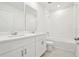 Bright bathroom featuring double sinks, white cabinets, tile flooring and shower and tub combination at 4544 Windy Oak Way, St Cloud, FL 34772