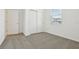 Bedroom features carpet flooring, a closet, a window, and freshly painted white walls at 4544 Windy Oak Way, St Cloud, FL 34772