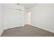 Clean bedroom offers gray carpet flooring, a closet, and fresh white walls at 4544 Windy Oak Way, St Cloud, FL 34772