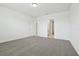 A carpeted bedroom with ensuite bathroom and walk in closet at 4544 Windy Oak Way, St Cloud, FL 34772