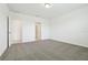 A carpeted bedroom with ensuite bathroom and walk in closet at 4544 Windy Oak Way, St Cloud, FL 34772