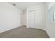 Bedroom features carpet flooring, a closet, and freshly painted white walls and a window at 4544 Windy Oak Way, St Cloud, FL 34772