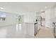 Bright, all-white kitchen with a center island and stainless steel appliances at 4544 Windy Oak Way, St Cloud, FL 34772