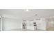 Bright, open-concept kitchen and living area with recessed lighting and stainless steel appliances at 4544 Windy Oak Way, St Cloud, FL 34772