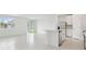 Bright, open-concept living space with tile floors, stainless steel appliances, and plenty of natural light at 4544 Windy Oak Way, St Cloud, FL 34772
