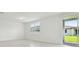 Bright and airy room with a large sliding door, a window, and neutral tile floors at 4544 Windy Oak Way, St Cloud, FL 34772