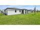 Expansive backyard featuring lush green grass, providing ample space for outdoor activities and relaxation at 4550 Windy Oak Way, St Cloud, FL 34772