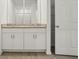 Bathroom featuring granite countertop vanity, storage, and shower at 4550 Windy Oak Way, St Cloud, FL 34772