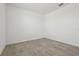 Empty room with tile flooring, base trim, and white walls at 4550 Windy Oak Way, St Cloud, FL 34772