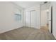 Bedroom with carpet, window, closet, and ensuite bathroom at 4550 Windy Oak Way, St Cloud, FL 34772