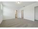 A large bedroom with plush carpet and ensuite bathroom at 4550 Windy Oak Way, St Cloud, FL 34772