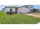 This is a lovely single-story home with a two-car garage, and well-maintained lawn at 4550 Windy Oak Way, St Cloud, FL 34772