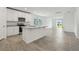 Modern kitchen with a central island, white cabinets, and stainless steel microwave at 4550 Windy Oak Way, St Cloud, FL 34772