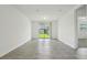 Bright and airy living room featuring modern tile floors and access to a patio at 4550 Windy Oak Way, St Cloud, FL 34772