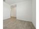 A spacious living room with modern tile flooring and neutral paint at 4550 Windy Oak Way, St Cloud, FL 34772