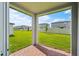 Covered patio overlooking a large fenced backyard and green lawn at 4556 Windy Oak Way, St Cloud, FL 34772