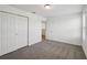Bedroom featuring neutral carpeting, white walls and closet space at 4556 Windy Oak Way, St Cloud, FL 34772