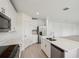 Bright kitchen features stainless steel appliances, a center island, and white cabinets at 4556 Windy Oak Way, St Cloud, FL 34772