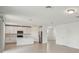Open kitchen featuring white cabinetry, stainless steel appliances, and a functional island at 4556 Windy Oak Way, St Cloud, FL 34772