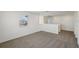 Bright loft with neutral carpeting, white walls, and a window offering natural light at 4556 Windy Oak Way, St Cloud, FL 34772