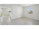 This room features grey tile flooring, white walls, and natural light at 4556 Windy Oak Way, St Cloud, FL 34772