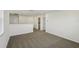 Large room featuring neutral carpet, white walls, and natural light at 4556 Windy Oak Way, St Cloud, FL 34772