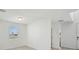 This room features white walls, natural light, and grey tile flooring at 4556 Windy Oak Way, St Cloud, FL 34772