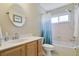 Neutral bathroom featuring a single sink vanity with marble countertops, and a tub-shower combo at 4638 Destrehan, Leesburg, FL 34748