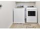 Well-lit laundry room with modern washer and dryer units, with a mat welcoming friends and Gathering at 5059 Lake Hamlin Trl, Winter Garden, FL 34787