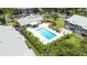 Aerial view of pool and clubhouse with chairs and manicured landscaping at 5417 Lake Margaret Dr # 39, Orlando, FL 32812