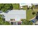 Aerial view showcasing the roof of the home, the parking lot, and the surrounding trees at 5417 Lake Margaret Dr # 39, Orlando, FL 32812