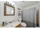 Bathroom featuring a single vanity, toilet, mirror, and shower/tub combo at 5417 Lake Margaret Dr # 39, Orlando, FL 32812
