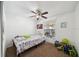 Bright bedroom features neutral paint, ceiling fan, plush carpeting and great natural light at 5417 Lake Margaret Dr # 39, Orlando, FL 32812