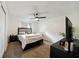 Cozy bedroom features neutral paint, ceiling fan and plush carpeting, creating a relaxing retreat at 5417 Lake Margaret Dr # 39, Orlando, FL 32812
