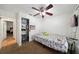 Cozy bedroom featuring a ceiling fan, closet, and neutral decor at 5417 Lake Margaret Dr # 39, Orlando, FL 32812
