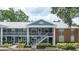 Inviting two-story condo featuring a charming brick accent, landscaped front and private outdoor balcony at 5417 Lake Margaret Dr # 39, Orlando, FL 32812