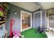 Screened patio with artificial grass and a view into the kitchen at 5417 Lake Margaret Dr # 39, Orlando, FL 32812