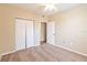 Cozy bedroom with ceiling fan and a closet with bifold doors at 5512 Metrowest Blvd # 203, Orlando, FL 32811