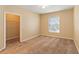 Bright bedroom with large window and walk-in closet at 5512 Metrowest Blvd # 203, Orlando, FL 32811