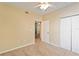 Bedroom with closet and doorway leading into another room at 5512 Metrowest Blvd # 203, Orlando, FL 32811