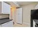 Kitchen with modern appliances and door leading outside at 5512 Metrowest Blvd # 203, Orlando, FL 32811