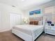 Relaxing bedroom with neutral color scheme, and large closet at 5528 Solterra Cir, Davenport, FL 33837