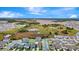 Wide aerial shot of a neighborhood with wetlands, construction, and green space in the distance at 5733 Iron Brand Rd, St Cloud, FL 34771