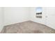 Bright bedroom with neutral carpet and a window letting in natural light at 5733 Iron Brand Rd, St Cloud, FL 34771