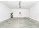 Spacious two-car garage with white walls and concrete flooring at 5733 Iron Brand Rd, St Cloud, FL 34771