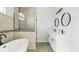 Modern bathroom with freestanding tub, frameless shower, and double sink vanity at 6084 Sw 150Th Ln, Ocala, FL 34473