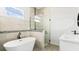 Contemporary bathroom featuring a soaking tub, glass-enclosed shower, and vanity with sleek fixtures at 6084 Sw 150Th Ln, Ocala, FL 34473