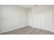 A clean, unfurnished room with new laminate floors and white walls at 6084 Sw 150Th Ln, Ocala, FL 34473